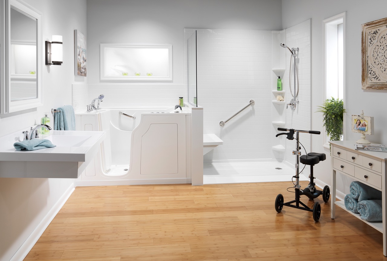 A bathroom with a walk-in tub alongside a low-step shower with a built-in bench and grab bars