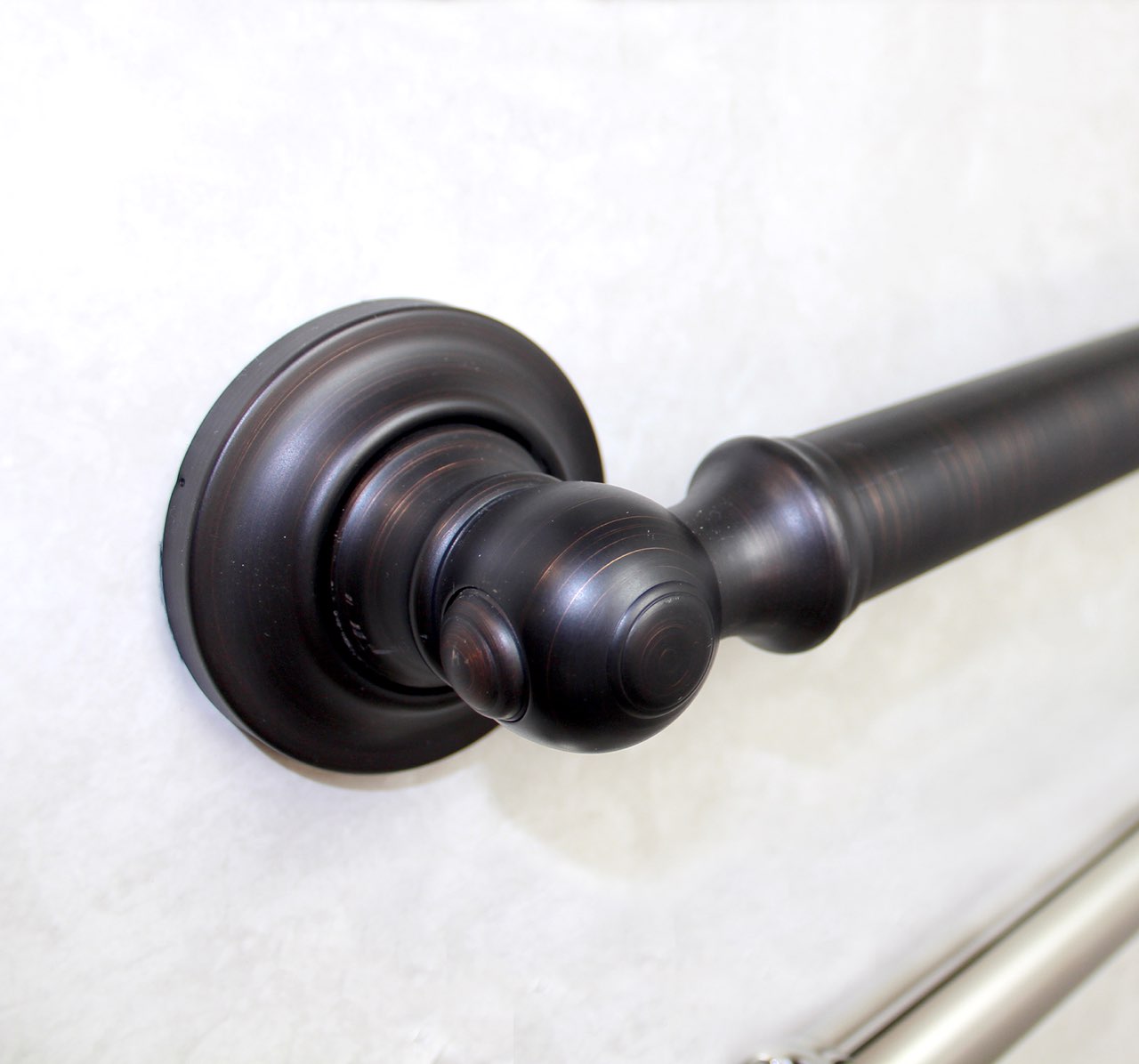 A close-up of oil-rubbed bronze bathroom hardware, showing the finish options available