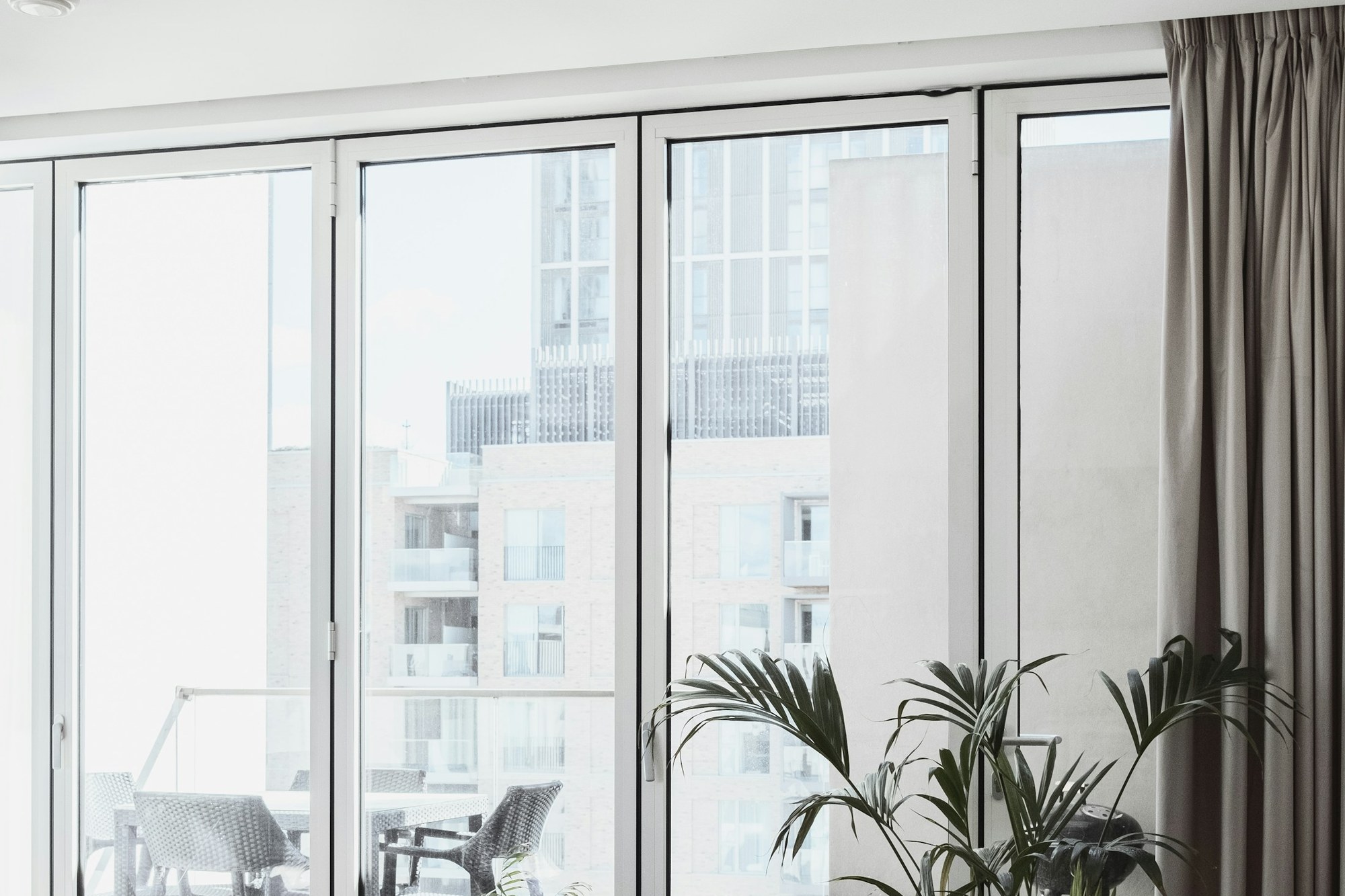 Glass patio doors opening onto an outdoor terrace, shown for illustration